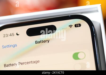 Paris, France - Sep 17, 2022: Close-up macro view of new way to show the battery percentage remain power on the new iphone 14 Pro with the dynamic island Stock Photo