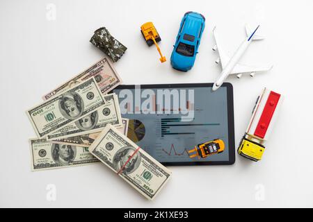 Tablet computer with different types of toy transport Stock Photo