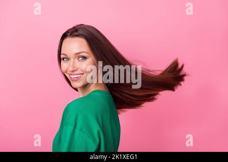 Side profile photo of pretty optimistic girlish fancy girl with straight hairdo wear green t-shirt isolated on pink color background Stock Photo