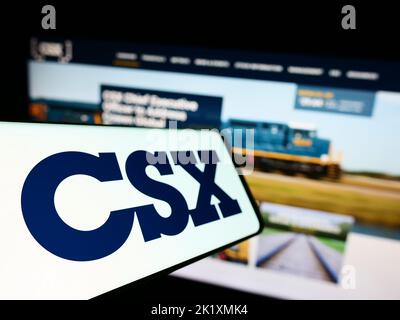 Logo of public company CSX Corp. displayed on a smartphone. Flag of USA ...