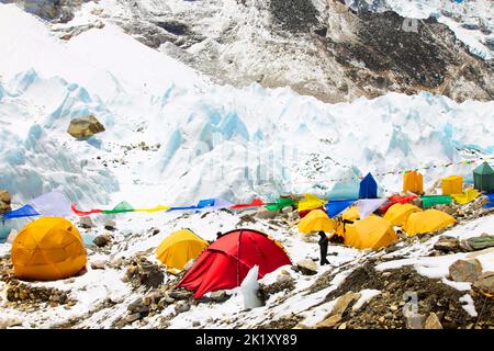 Bright yellow tents in Mount Everest Base Camp, Khumbu glacier and mountains, Sagarmatha national park, Nepal, Himalayas Stock Photo