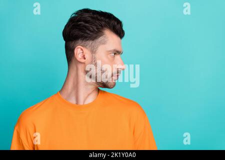 Side profile photo of young attractive handsome bearded serious look empty space new advert professional programmer isolated on aquamarine color Stock Photo