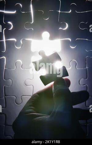 Everythings falling into place. a puzzle missing a single piece. Stock Photo