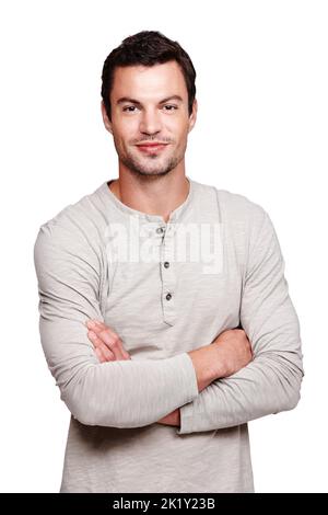 Casual and confident. Portrait of a handsome young man crossing his arms while isolated on white. Stock Photo