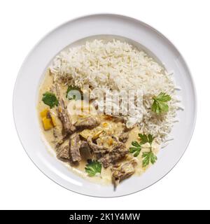 Beef Stroganoff with rice on plate isolated on white, top view Stock Photo