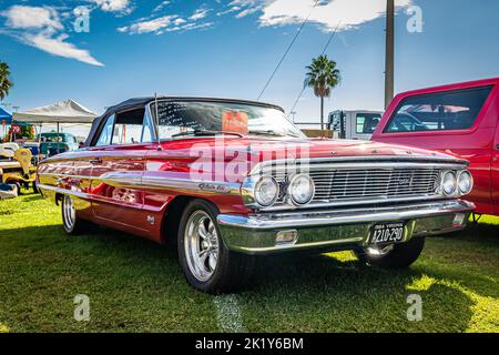 Daytona Beach, FL - November 28, 2020: Low perspective front corner view of a 1964 Ford Galaxie 500 Convertible at a local car show. Stock Photo