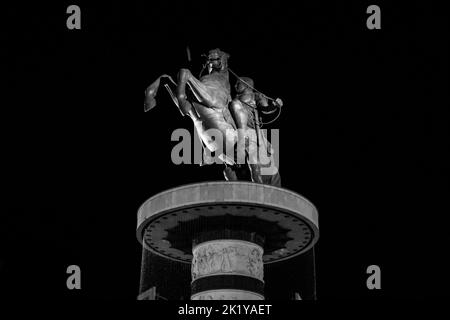 Fountain in Macedonia Square, Skopje, and statue of Warrior on Horse, resembling Alexander the Great. Controversial monument in North Macedonia. Stock Photo