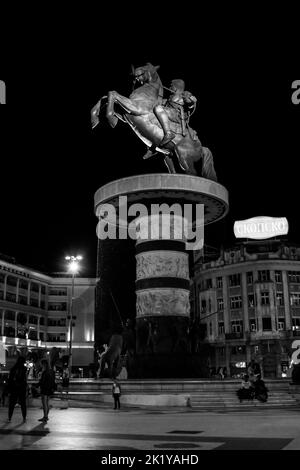 Fountain in Macedonia Square, Skopje, and statue of Warrior on Horse, resembling Alexander the Great. Controversial monument in North Macedonia. Stock Photo