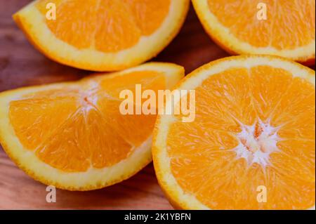 Sliced Oranges on a wood background Stock Photo