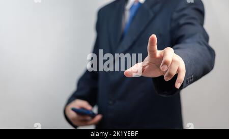 Businessman pressing button on virtual screen.copy Space for text. Stock Photo