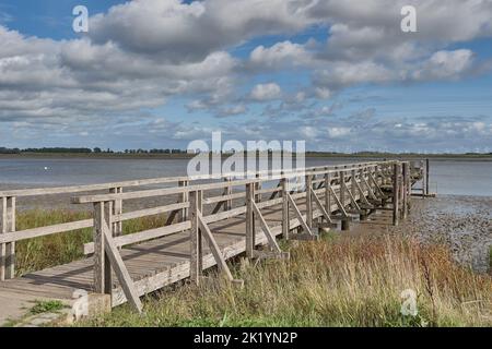 Jetty in swimming area of Toenning at Eider River,North Frisia,Germany Stock Photo