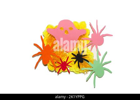 yellow flowers full of spiders and ghosts on white background, creative art design, paper craft Stock Photo
