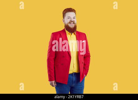 Happy fat ginger man wearing funny outfit standing isolated on yellow background Stock Photo