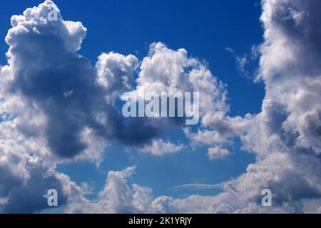 Beautiful storm clouds on the blue sky. An approaching storm.. Stock Photo
