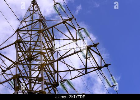Power plant tower close-up against the blue sky. Energy crisis concept. Stock Photo