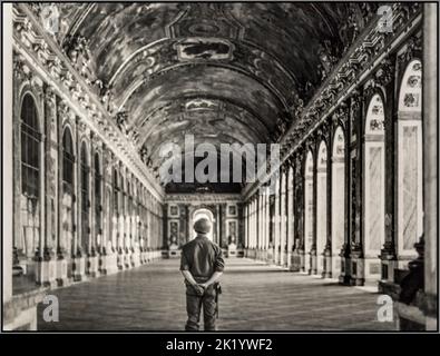 FRANCE FRENCH WW2 LIBERATION 'A Yank in Versailles’ by Bert Brandt photographer..American propaganda image taken during the liberation of France in World War II WW2 aftermath Pvt. Gordon Conrey of Milford, N.H., one of the first Americans to visit Versailles after its liberation, standing in the hall of mirrors. Date 1944 Stock Photo