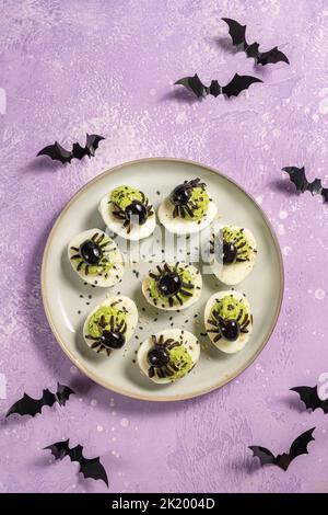 Deviled eggs with a Spider for Halloween Stock Photo