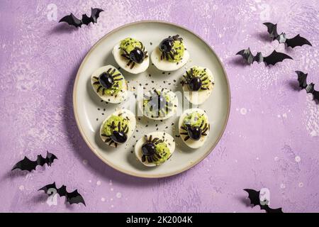 Deviled eggs with a Spider for Halloween Stock Photo