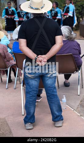 Visitors watch Native American members of the Zuni Olla Maidens from the Zuni Pueblo near Gallup, New Mexico, perform in Santa Fe, New Mexico. Stock Photo