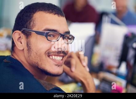 Im the programmer you need. a handsome young programmer at work. Stock Photo