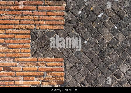 Different patterns and materials of ancient house wall in Pompei Stock Photo