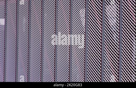 Aluminium mesh pattern on black background Stock Photo
