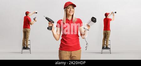 Team of technicians installing security cameras Stock Photo