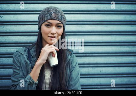 Shes an urban woman. an attractive young woman out in the town. Stock Photo