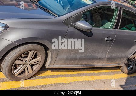 Car illegally parked on double yellow lines in Cardiff, Wales, UK Stock Photo