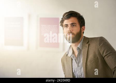 Go confidently in the direction of your dreams. a businessman in an office. Stock Photo