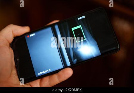 Security camera on mobile app with face recognition. Stock Photo