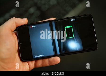 Security camera on mobile app with face recognition. Stock Photo