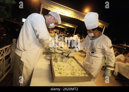 ISTANBUL, TURKEY - AUGUST 10: Turkish chefs preparing famous Turkish traditional dessert ‘Gullac’ on August 10, 2011 in Istanbul, Turkey. Stock Photo
