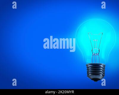 When the lightbulb goes off. Studio shot of a lightbulb against a blue background. Stock Photo