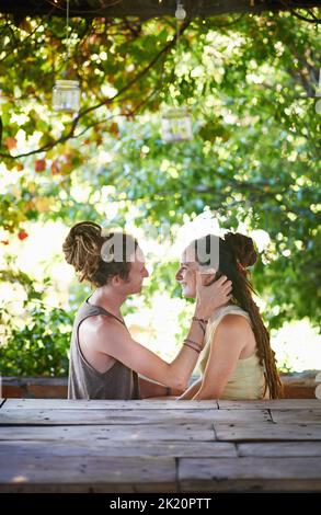 Their connection is undeniable. A cute young couple spending time together outdoors. Stock Photo