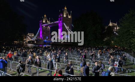 Mourners continue to queue in the night along River Thames southbank to see Queen Elizabeth II lie in state in Westminster Hall.   Pictured: Snake que Stock Photo