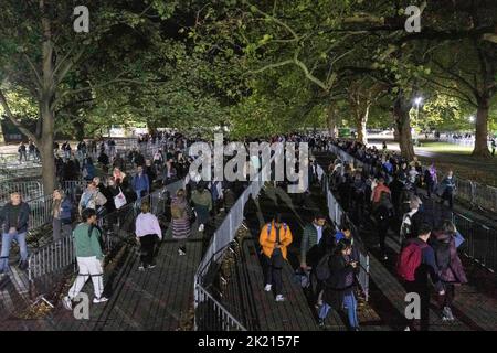 Mourners continue to queue in the night along River Thames southbank to see Queen Elizabeth II lie in state in Westminster Hall.   Pictured: snake que Stock Photo