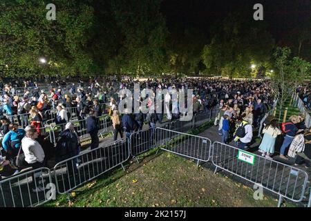 Mourners continue to queue in the night along River Thames southbank to see Queen Elizabeth II lie in state in Westminster Hall.   Pictured: snake que Stock Photo