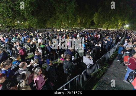 Mourners continue to queue in the night along River Thames southbank to see Queen Elizabeth II lie in state in Westminster Hall.   Pictured: snake que Stock Photo