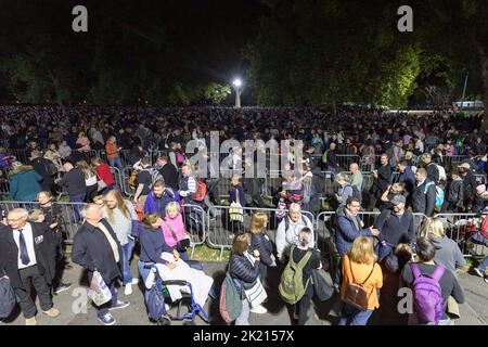 Mourners continue to queue in the night along River Thames southbank to see Queen Elizabeth II lie in state in Westminster Hall.   Pictured: snake que Stock Photo