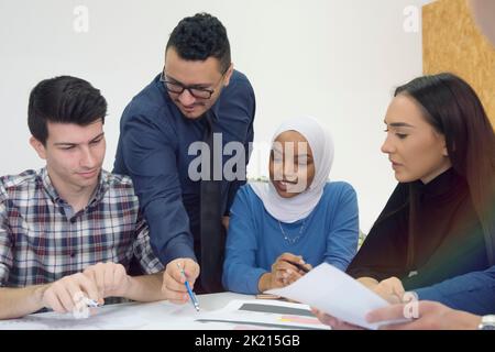 Professor having discussion with his college students Stock Photo