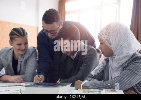Professor having discussion with his college students Stock Photo