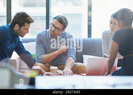 This should be our next move. a group of office workers talking together in a meeting room. Stock Photo