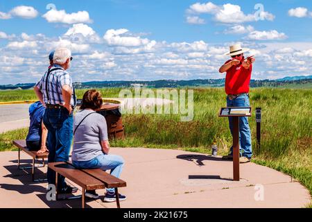 Native American Indian tourguide and visitors; Little Bighorn Battlefield National Monument; Montana; USA Stock Photo