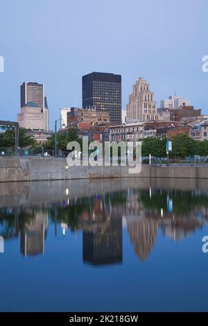 Montreal skyline reflected in Bonsecours Basin at dawn in spring, Quebec, Canada. Stock Photo
