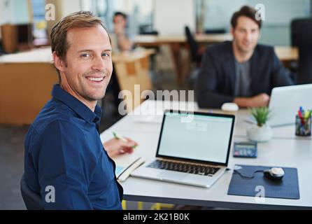 Developing tomorrows tech today. a designer at their workstation in an office. Stock Photo