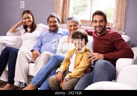Family over everything. Portrait of a family bonding together in the living room. Stock Photo