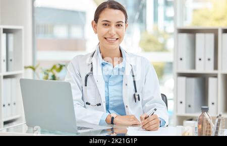 Doctor insurance, writing hospital report and working on healthcare documents in office, smile for medical checklist and paperwork for medicine at Stock Photo