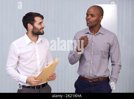 Sharing the secrets to success. two businessmen having a discussion. Stock Photo