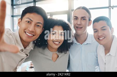 Happy, business and portrait of a team taking a selfie while working in modern office. Diversity, smile and creative group of work friends taking Stock Photo